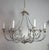 A sculptural custom chandelier created exclusively for Miamar Home, inspired by 18th and 19th century European wrought-...