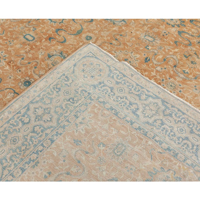 The circa-1920 antique Indian rug features an all-over design of lozenge latticed palmette patterns. Floral abstractions,...