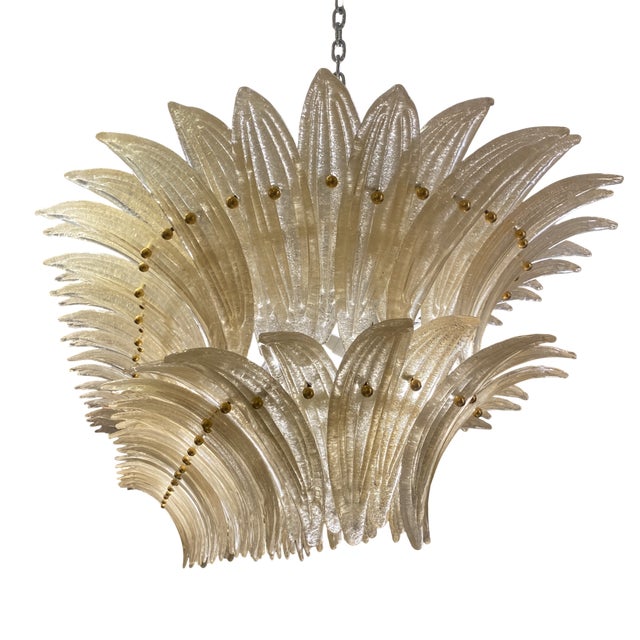 A large murano glass ceiling lamp by barovier & toso, handcrafted with a frozen gold effect. Its palmette petals, made of...