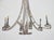 A French chandelier from the 19th century, crafted in hand-forged iron and richly detailed with strings of cut glass...
