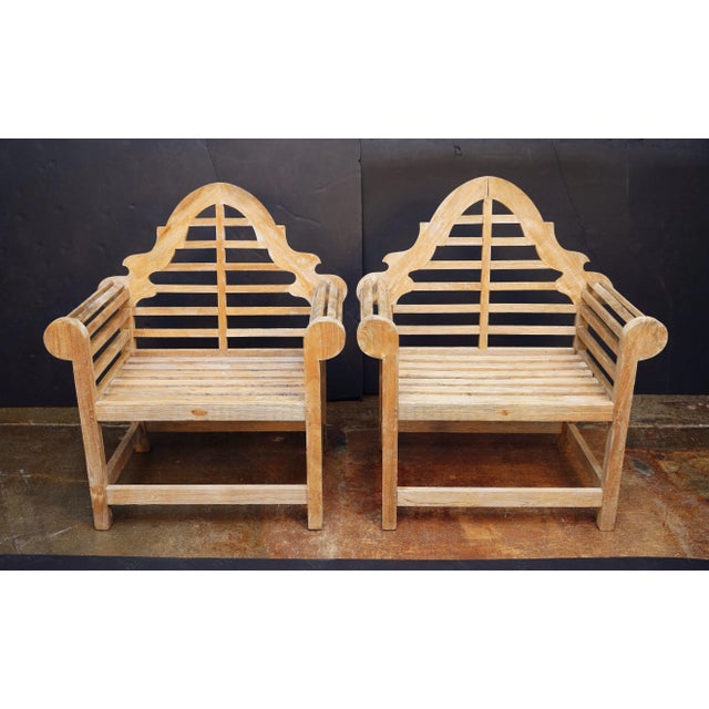 A fine pair of vintage Lutyens style teak garden chairs after Sir Edwin Lutyens, the British architect renowned for his...