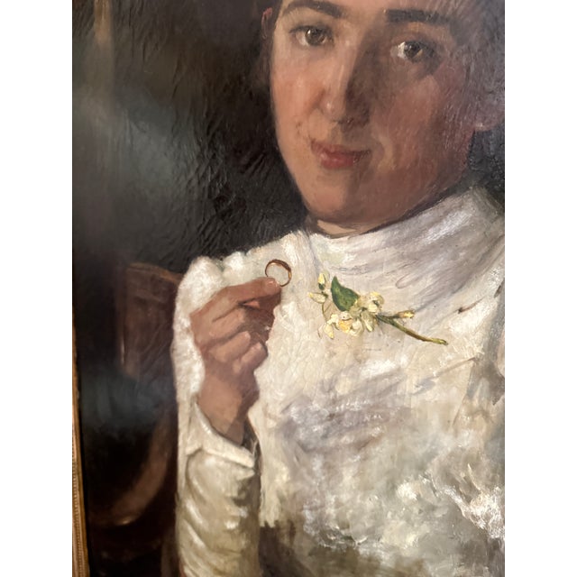 This antique portrait is of a young girl from the Netherlands who is posing with her new ring. It was a family member of...