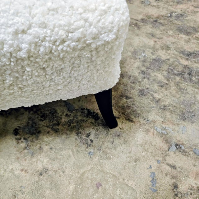 No button tufting or biscuits on this chair. That has been ruled out. The legs are tapered and have a French curve. I...