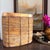 A striking oversized vintage rattan basket in the style of Gabriella Crespi, featuring a sculptural rounded square form...