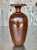 Add a touch of warm, organic beauty to your home with this vintage vase, skillfully crafted from a solid piece of wood...
