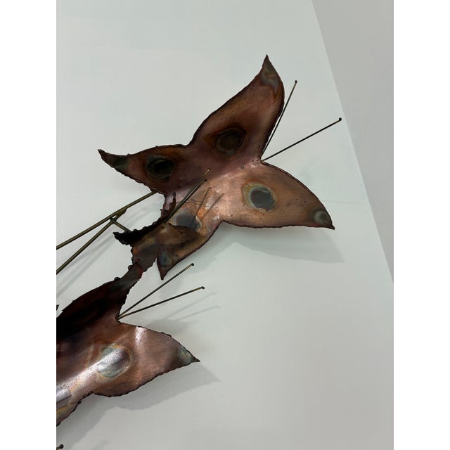 A striking and highly collectible example of American brutalist metalwork, this vintage copper wall sculpture is one of...