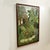 Mid century Haitian acrylic painting on canvas of a colorful jungle scene with fruit, monkeys and a bird executed in a...
