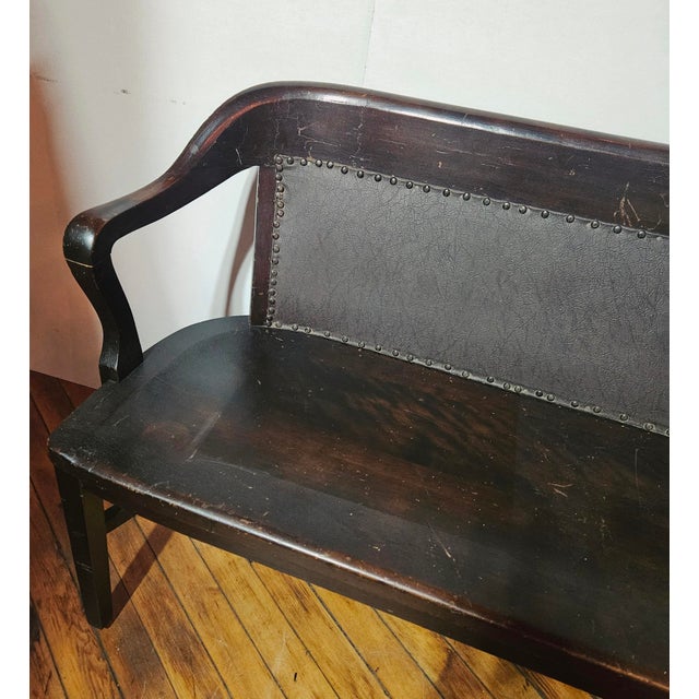 This 1900s Sikes Chair Co. Mahogany & Leather Bench features an ergonomic curved crest rail blending into flowing, drop-...