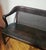 This 1900s Sikes Chair Co. Mahogany & Leather Bench features an ergonomic curved crest rail blending into flowing, drop-...