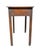 Rectangular top over a drawer with brass handles. Square legs.