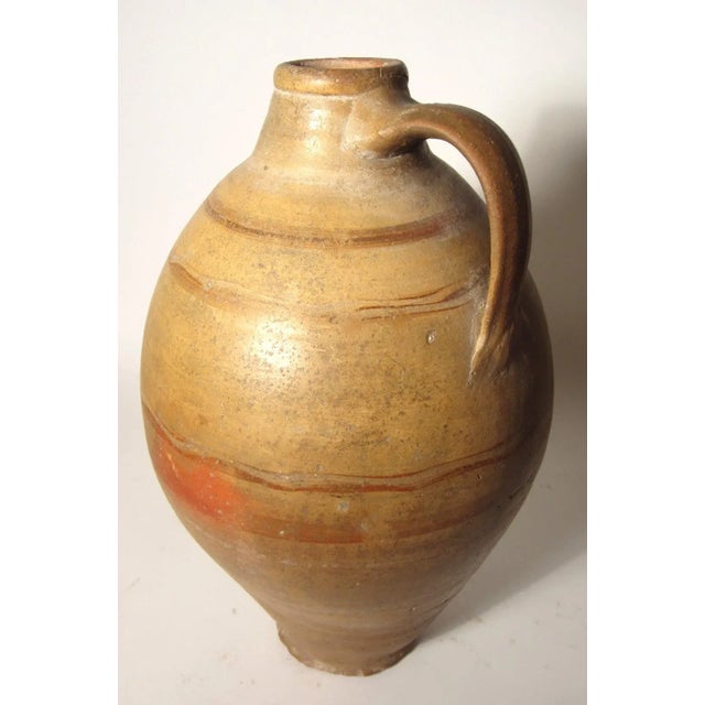 A pair of terracotta/clay oil jugs. These are very old and well used with a hand rubbed finish. Perfect as interior décor....