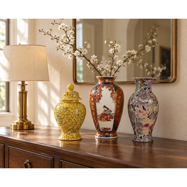 A colorful trio of decorative ceramic vessels featuring complementary floral patterns and graceful silhouettes. The...