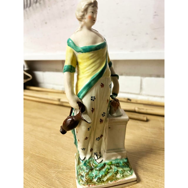 Beautiful example of Neoclassical Staffordshire Pearlware, circa 1820, Georgian era. Figure represents the Greek Goddess...