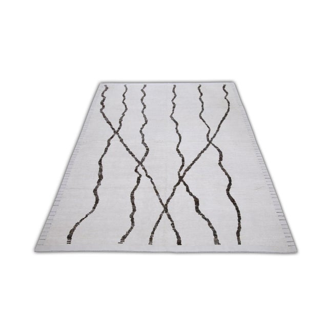 Introducing our exquisite handwoven wool modern Moroccan-style rug, a stunning blend of traditional craftsmanship and...