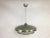 The ceiling lamp was manufactured by L'udib from Bratislava in the 1950s. The upper part and lower rim of the saucer are...