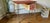 Desk dating from the 1960s. Chrome-plated tubular metal frame / Wood covered in red and white marbled vinyl. Some signs of...