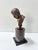 A finely detailed classical male portrait bust in dark patinated bronze, mounted on a burgundy veined marble column with a...