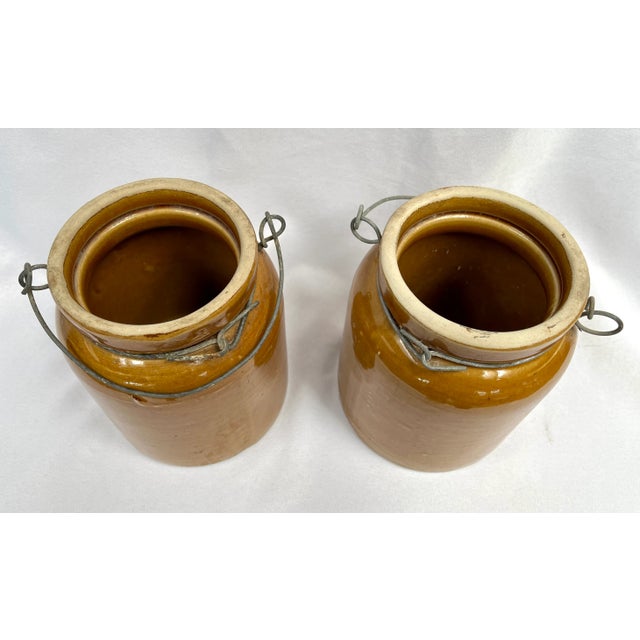 Early 20th Century Antique Glazed French Crocks With Metal Carriers - a Pair For Sale - Image 5 of 9