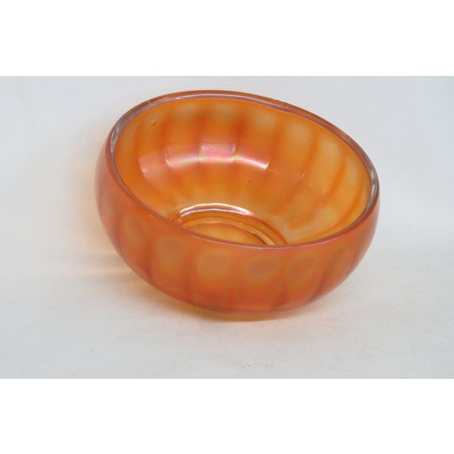 This beautiful candy dish / bowl is made of glass. This lovely dish is made in a wonderful marigold orange color with a...