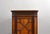 A charming Edwardian mahogany corner cabinet, dating to circa 1900, offering both elegant design and practical storage in...