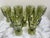 Vintage set of nine olive green pedestal glasses or goblets with ribbed design. Perfect for iced tea or water goblets at...