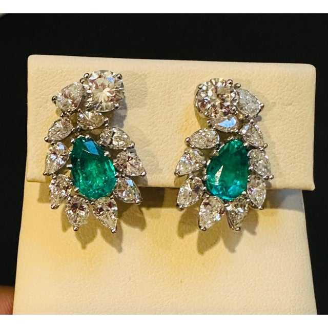 GIA Certified F1 4ct Colombian Emerald and 2 GIA Certificates for each of the Diamond 0.85 ct FVVS2 and 0.99 ct GVVS2...
