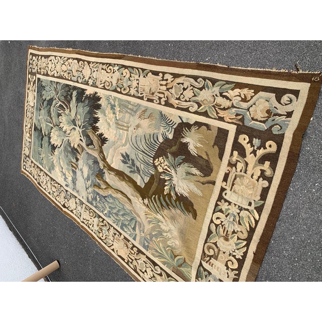 Place this long and narrow antique tapestry in a staircase or in between two windows for a pop of color. Handwoven in...
