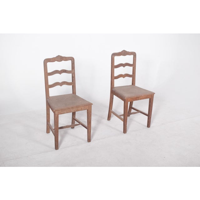 Pair of flowered chairs. Made of solid wood with a traditional design, possibly of rural origin or in the Brazilian...