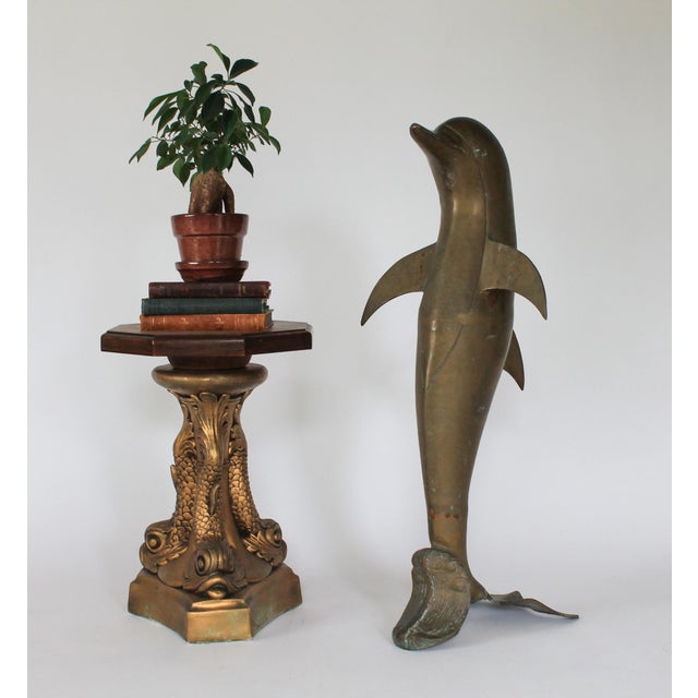 Vintage brass dolphin sculpture. No makers mark. Some age wear, patina and oxidation.