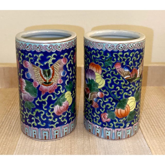 Hand-Painted Blue Brush Pots (Pair) A striking pair of hand-painted porcelain brush pots, each rendered in deep cobalt...