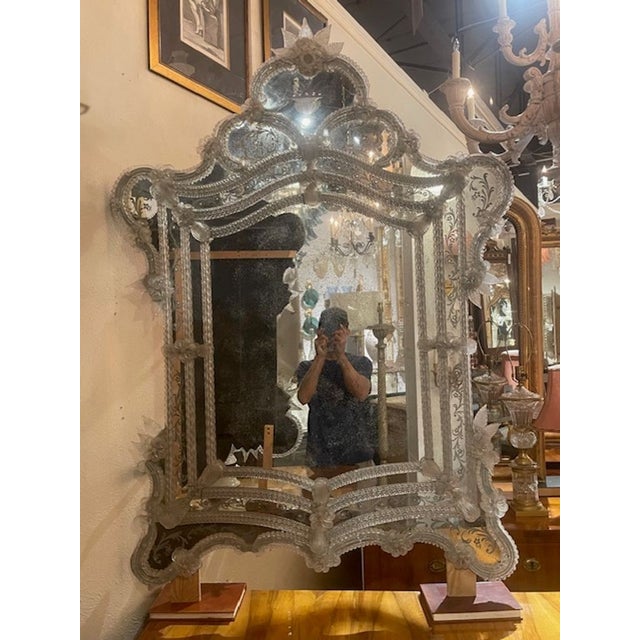 The Antique Venetian Etched Glass Mirror is a stunning piece that adds a touch of elegance to any room. With its etched...