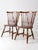 This is a pair of mid 20th century vintage Ethan Allen walnut dining chairs. The classic "Duxbury" Windsor style chairs...