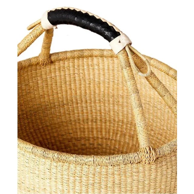Artisans in the Bolgatanga region of Ghana weave these beautiful and durable baskets from thick, tough elephant grass. A...