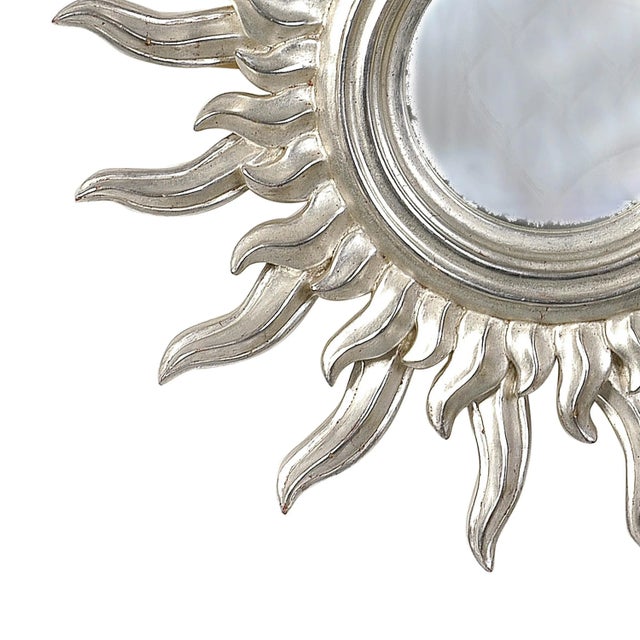 French mirror in the form of sun carved by polychrome hand finished in a silver bath.
