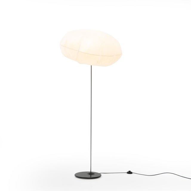 The Globlow Floor Lamp was designed in 1996 by Vesa Hinkola, Markus Nevalainen, and Rane Vaskivuori for the Finnish design...