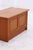 Vintage chest from Dyrlund, crafted from warm teak with a finely worked front and rounded top. The lid opens to reveal...