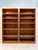 Pair of vintage teak bookcases by Sun Cabinet Co., featuring warm teak tones, beautiful natural wood grain, and a clean,...