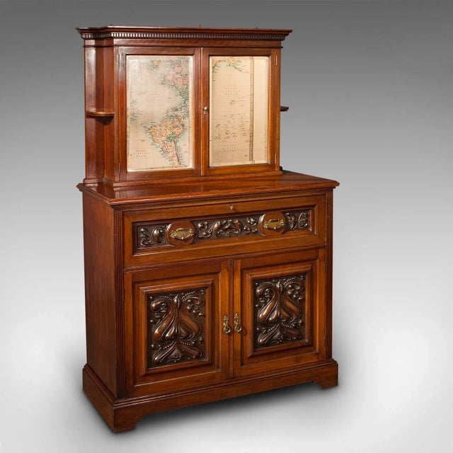 This is an antique secretaire sideboard. An English, mahogany drop-front correspondence cabinet, dating to the late...