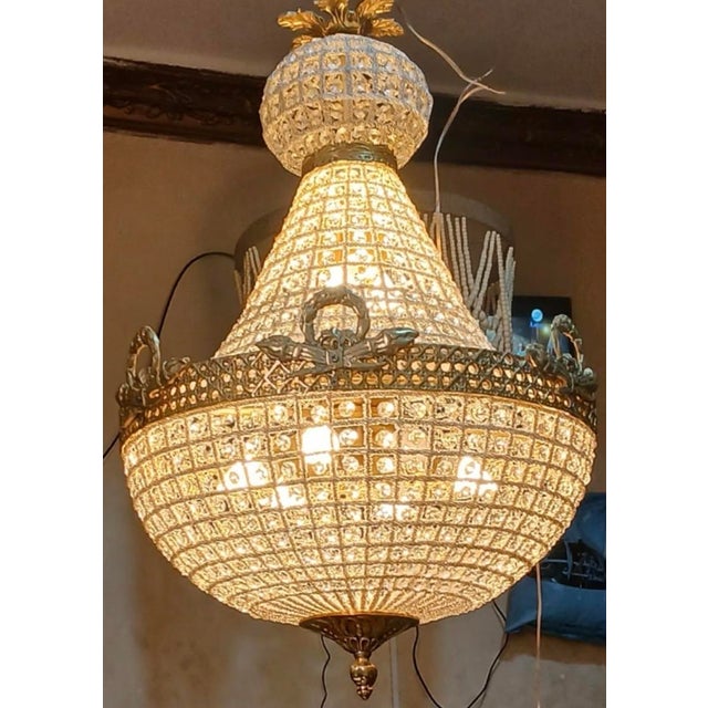 Up for consideration is a beautiful vintage crystal and gold Hollywood regency chandelier. This would look lovely in your...
