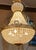 Up for consideration is a beautiful vintage crystal and gold Hollywood regency chandelier. This would look lovely in your...
