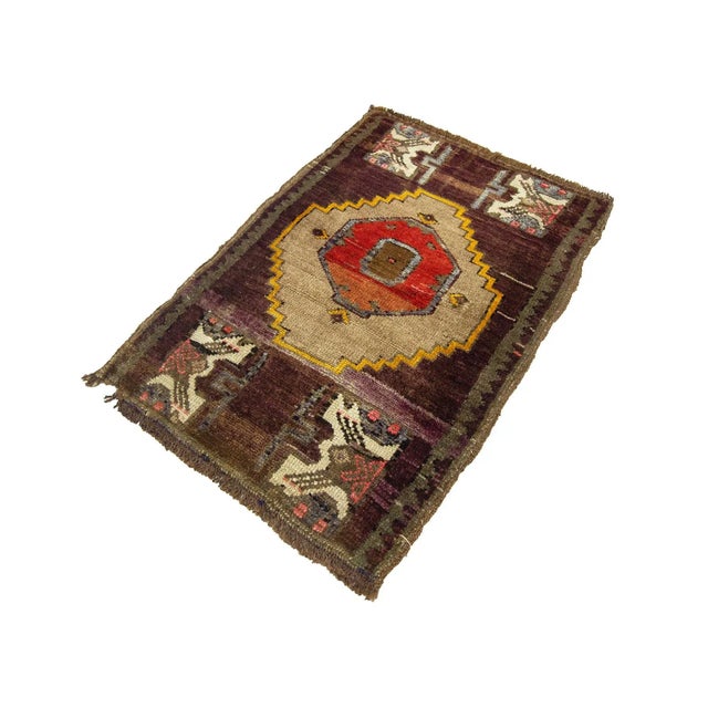 Vintage Handknotted decorative mini rug from Kars region of Turkey. Approximately 45-55 years old. In very good condition.