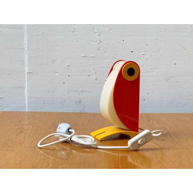Rare italian table lamp made of colored plastic with an expressive, almost graphic design. The lamp consists of a curved,...
