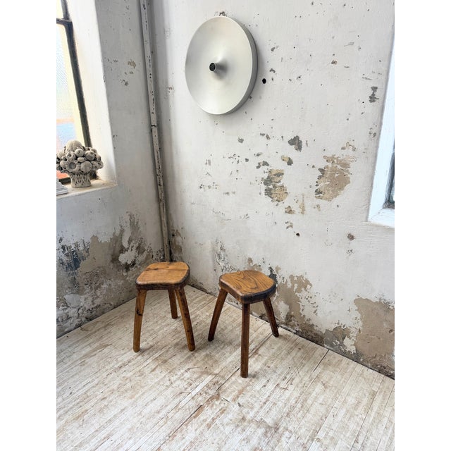 Pair of oak stools on tripod bases, free-form design by henri bataille, circa 1960s. a very elegant model, with a refined...