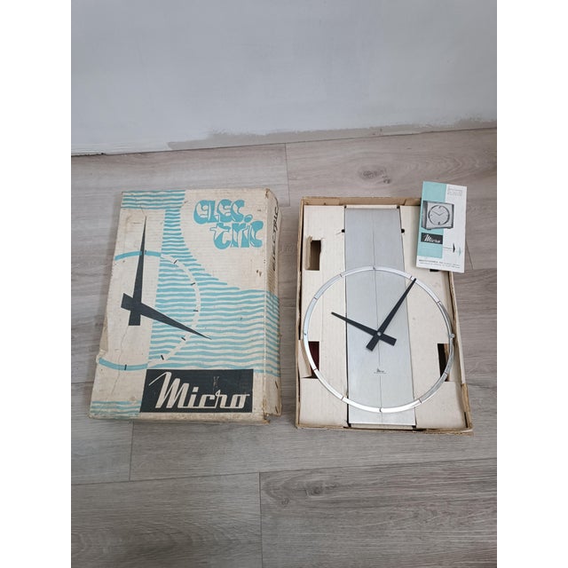 Exquisite Micro Electric wall clock by Microtecnica SA Madrid, Spain, 1970s Brushed aluminum frame. The ring indicating...