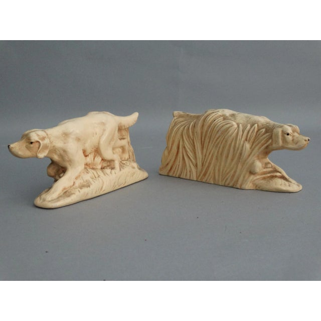 A vintage pair of McCoy bookends of sporting or hunting dogs. These date to mid 20th-Century and are hand molded and...
