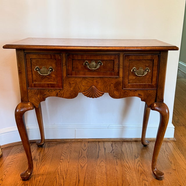 Hekman Queen Anne Lowboy Burled wood with brass hardware in a traditional dressing table/low boy. Minimal age appropriate...