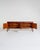 Teak sideboard with four upper drawers featuring distinctive recessed handles and four doors enclosing compartments with...