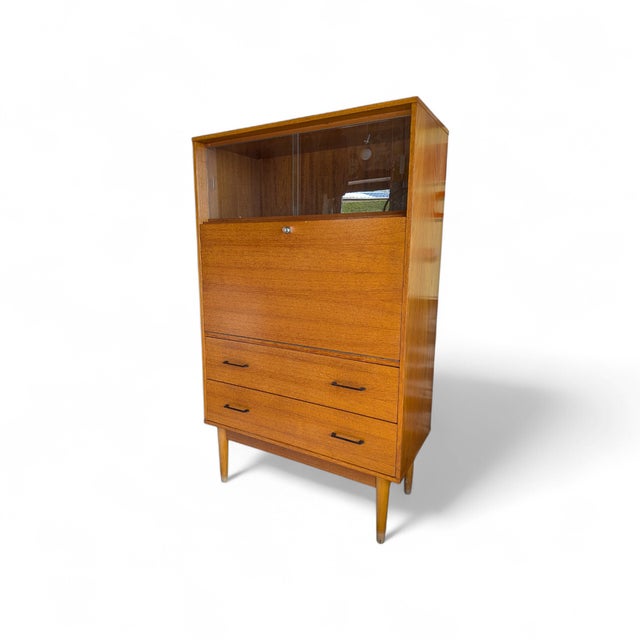The Vibe: Bring authentic 1960s European elegance to your home office. ​The Piece: This superb vintage "Brissac" secretary...