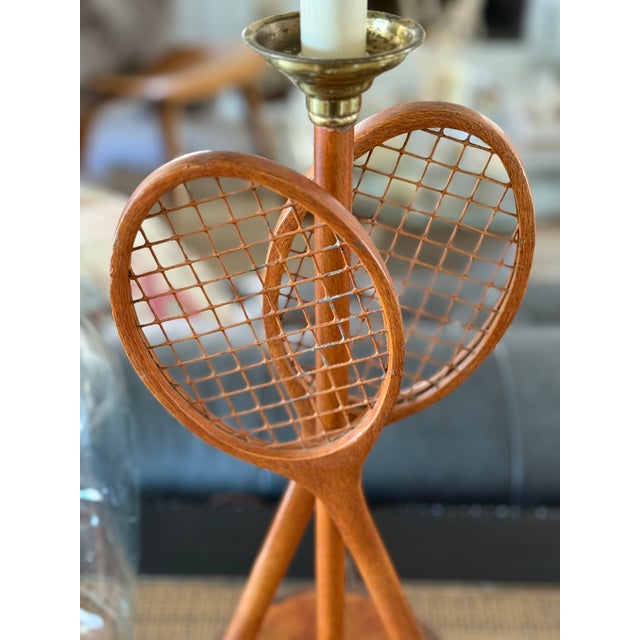Vintage Maitland-Smith tennis racquet table lamp. Metal wood grain crossed racquets rest atop a leather base with great...