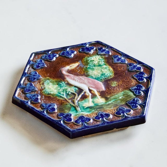 Magnificent antique polychrome slipware trivet from the 19th century, attributed to the Onnaing pottery works. Hexagonal...